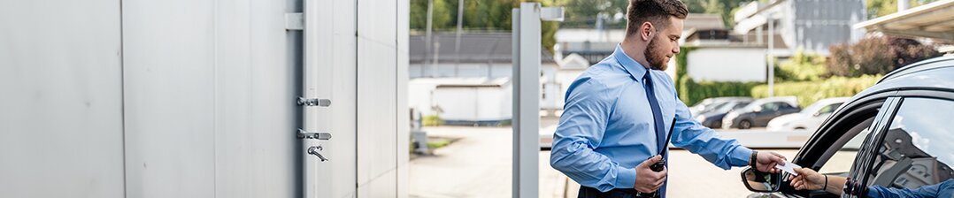 Safety specialist with headset in front of monitor