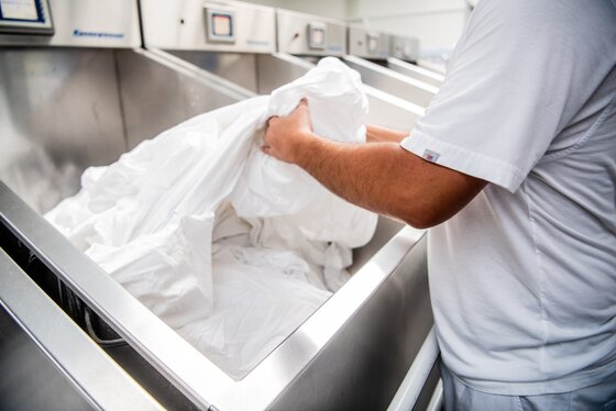 Laundry agent sorting clean laundry