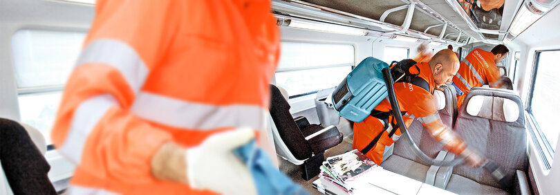 Cleaners clean train from the inside 